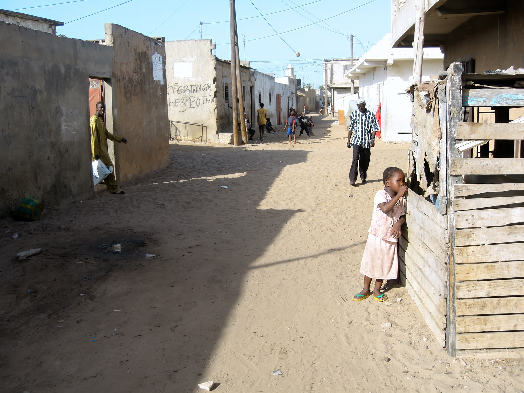 Girl on sandy street, Dakar