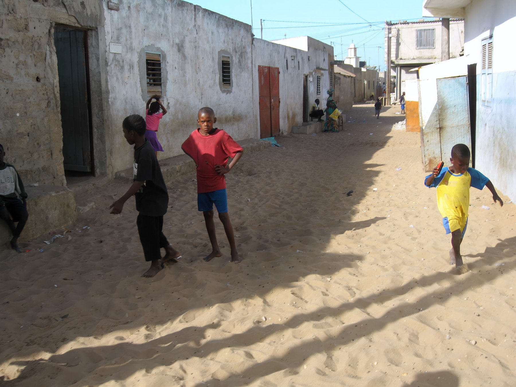 Children playing on sandy street, Dakar