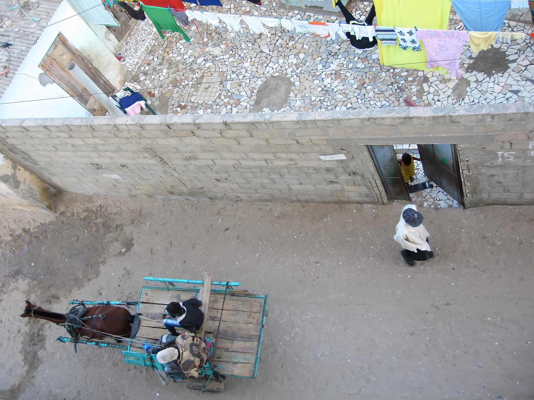 Aerial view of horse cart and laundry, Dakar