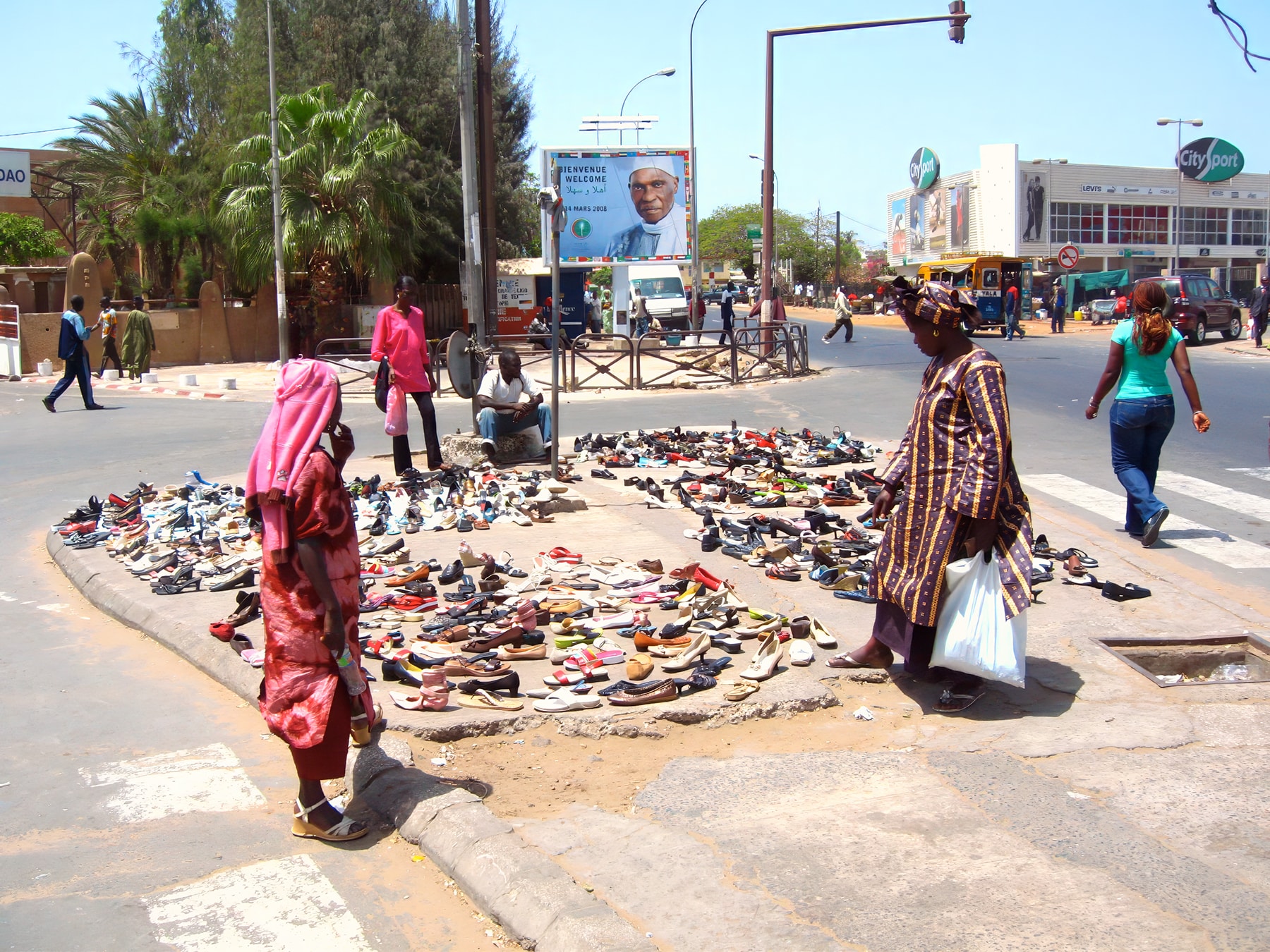 Street shoe market at intersection, Dakar